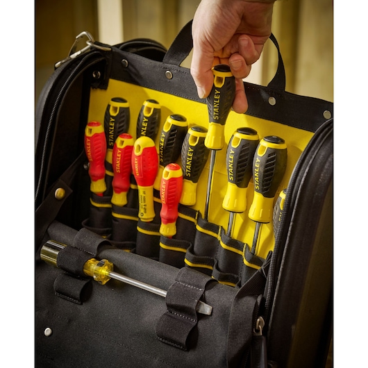 STANLEY 1-94-231 screwdriver set in black and yellow tool bag, hand removing screwdriver, front angle.