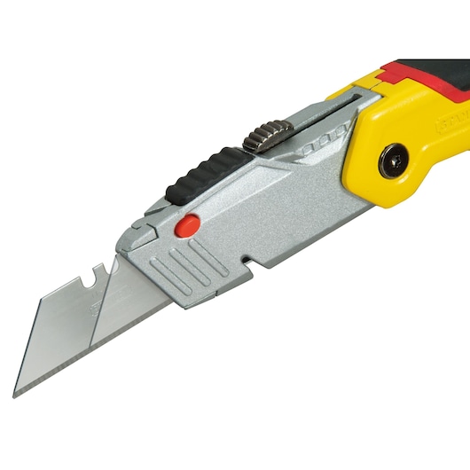 Stanley utility knife with retractable blade and yellow handle, close-up of cutting edge.
