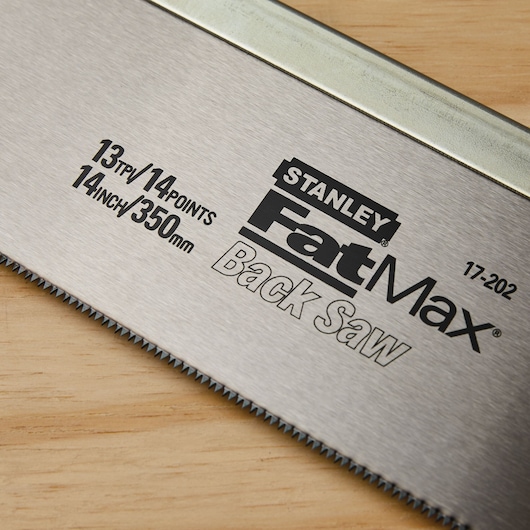 STANLEY FatMax 17-202 back saw blade, 14 inch 350 mm, 13 tpi, close-up on wood surface.