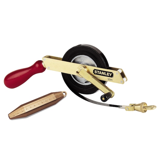 STANLEY 34-277 measuring tape with brass plumb bob, red handle, and metal frame, front angle on white background.