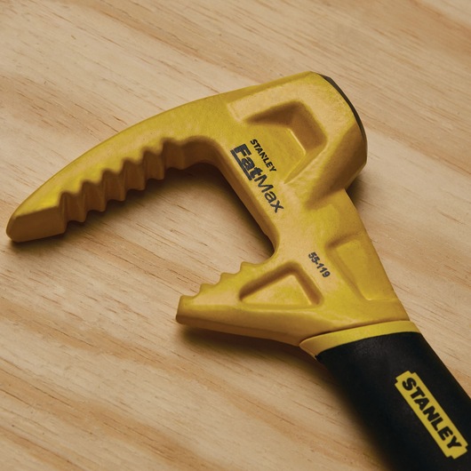 Stanley 55-119 FatMax yellow utility bar with serrated edge, close-up on wooden surface