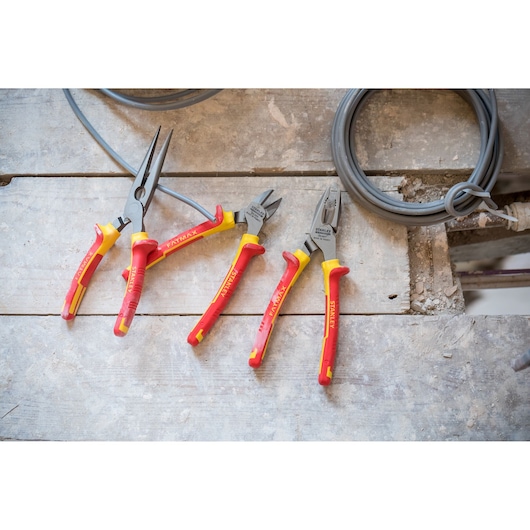 STANLEY 84-011-S insulated pliers set with red and yellow handles on wooden surface, three types for electrical work.
