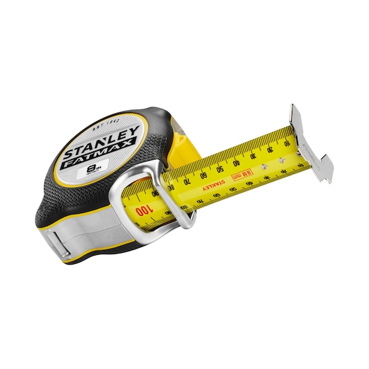 STANLEY FMHT38219-3 tape measure, yellow and black, angled view on white background.