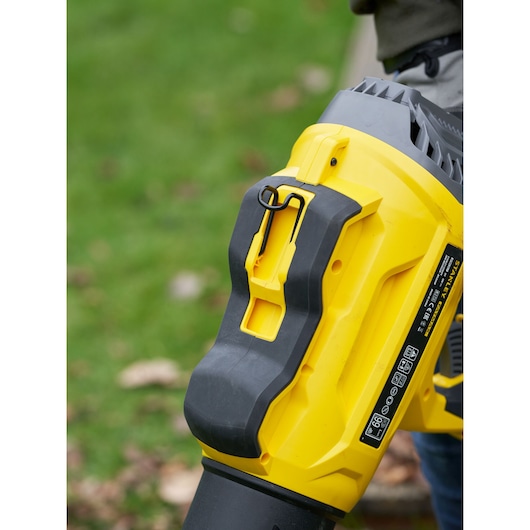 STANLEY SFMCBL7B leaf blower close-up, yellow and black body, outdoor use scene