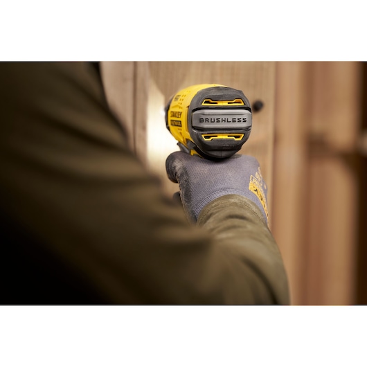 Photo of STANLEY SFMCF910B impact driver in use, close-up on brushless motor label.