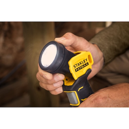Stanley SFMCL020B photography of handheld yellow and black Fatmax cordless LED spotlight.