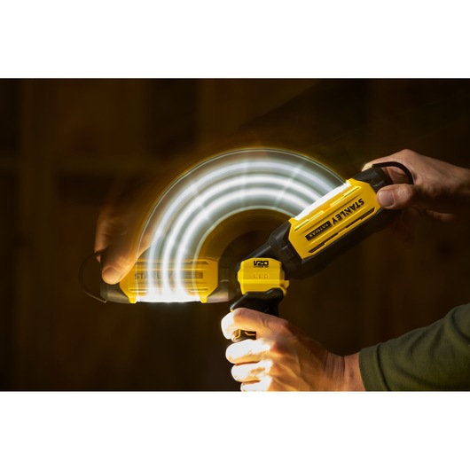 Photo of STANLEY SFMCL050B 18V STANLEY FATMAX V20 Pivot Light in use, showing adjustable head in motion.