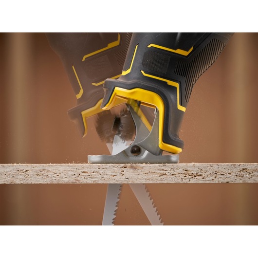 STANLEY SFMCS311B-XJ reciprocating saw close-up action cutting wood, photography.