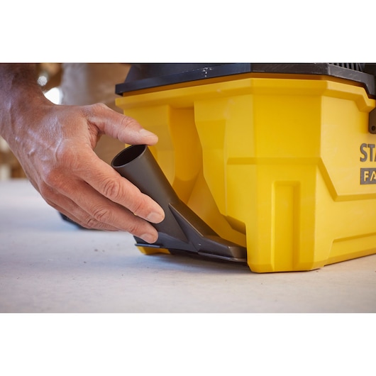 STANLEY SFMCV002B vacuum connector attachment shown on yellow vacuum base, close-up photography.
