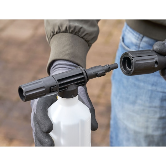 STANLEY SFMPW2400 foam lance attachment, black nozzle and bottle, close-up outdoor photography.