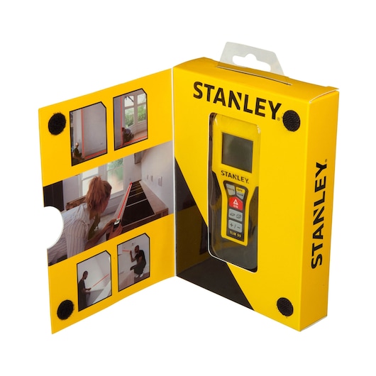 Photo of STANLEY STHT1-77138 laser distance measurer in yellow retail packaging, shown from angled front view.